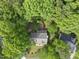 Aerial perspective capturing the home and the surrounding lush greenery and trees at 204 Black Forest Dr, Clayton, NC 27527