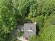 Overhead shot of a house with mature trees offering natural shade, and beautiful landscaping in a well-established neighborhood at 204 Black Forest Dr, Clayton, NC 27527