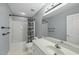 Bathroom featuring a tub with shower, vanity with sink, and neutral walls at 204 Black Forest Dr, Clayton, NC 27527