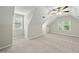 Spacious bonus room with sloped ceilings, plush carpet, and a ceiling fan at 204 Black Forest Dr, Clayton, NC 27527