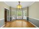 Charming dining area featuring a bay window and an elegant chandelier at 204 Black Forest Dr, Clayton, NC 27527