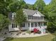 Charming two-story home with a welcoming front porch and beautiful landscaping at 204 Black Forest Dr, Clayton, NC 27527