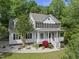 Charming two-story home with a welcoming front porch and well-manicured landscaping at 204 Black Forest Dr, Clayton, NC 27527