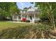 Beautiful two-story home with a covered front porch, perfect for relaxing outdoors at 204 Black Forest Dr, Clayton, NC 27527