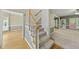 Inviting foyer with a staircase, hardwood floors, and a view into the living spaces at 204 Black Forest Dr, Clayton, NC 27527