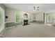 Inviting living room with a cozy fireplace and ample natural light at 204 Black Forest Dr, Clayton, NC 27527