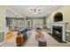 Comfortable living room with fireplace and seamless access to dining area at 204 Black Forest Dr, Clayton, NC 27527