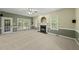 Bright living room features neutral carpet, a fireplace, ceiling fan, and lots of natural light from the large windows at 204 Black Forest Dr, Clayton, NC 27527