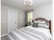 Bedroom with a comfortable bed, soft lighting, and a window at 204 Flint Point Ln, Holly Springs, NC 27540