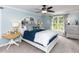 Inviting bedroom features a comfortable bed, a large window, and stylish decor at 204 Flint Point Ln, Holly Springs, NC 27540