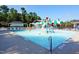 Community splash pad with colorful water features and play areas for children at 204 Flint Point Ln, Holly Springs, NC 27540