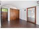 Bedroom boasts hardwood floors, closet with wood doors, and ample natural light at 205 Wood Cir, Chapel Hill, NC 27514