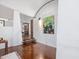 Open hallway showcasing hardwood floors and modern decor, leading to other parts of the home at 205 Wood Cir, Chapel Hill, NC 27514