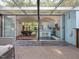 View of the kitchen and an outdoor patio with a glass roof, creating a seamless indoor/outdoor living space at 205 Wood Cir, Chapel Hill, NC 27514