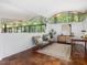 Bright modern living room with hardwood floors, minimalist design and nature views at 205 Wood Cir, Chapel Hill, NC 27514