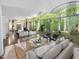Spacious living room with floor-to-ceiling windows offering a view of the surrounding greenery at 205 Wood Cir, Chapel Hill, NC 27514