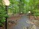 Gravel path with modern lighting fixtures that lead to the property at 205 Wood Cir, Chapel Hill, NC 27514