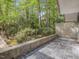 Outdoor patio featuring stone flooring surrounded by lush greenery at 205 Wood Cir, Chapel Hill, NC 27514