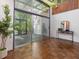 Sunroom with an all-glass ceiling and wall letting sunlight into the home at 205 Wood Cir, Chapel Hill, NC 27514