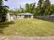 Back of the home featuring a large yard, storage shed, and patio area at 2101 S Roxboro St, Durham, NC 27707