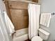 Clean bathroom featuring a tub, shower with tiled walls, and a new toilet at 2101 S Roxboro St, Durham, NC 27707
