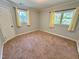 Spacious bedroom with carpet, natural light, and neutral tones is ready for personalization at 2101 S Roxboro St, Durham, NC 27707