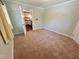 Bedroom leading to kitchen with carpet, natural light, and neutral tones is ready for personalization at 2101 S Roxboro St, Durham, NC 27707