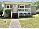 Charming single-story home with a well-maintained front lawn and welcoming porch at 2101 S Roxboro St, Durham, NC 27707