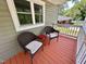 Comfortable wicker chairs on the covered front porch, ideal for relaxation at 2101 S Roxboro St, Durham, NC 27707