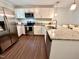 Updated kitchen featuring stainless appliances, granite counters, and wood floors at 2101 S Roxboro St, Durham, NC 27707