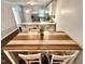 Bright eat-in kitchen boasts stainless steel appliances, granite countertops, and white cabinetry at 2101 S Roxboro St, Durham, NC 27707
