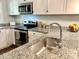 Close up of the stainless sink and countertop of the renovated kitchen at 2101 S Roxboro St, Durham, NC 27707