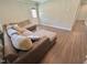 Cozy living room features a large sectional sofa, wood-look floors and abundant seating at 2101 S Roxboro St, Durham, NC 27707