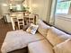 Comfortable living area boasts a large sectional sofa, decorative pillows, and wood-look floors at 2101 S Roxboro St, Durham, NC 27707