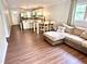 Open-concept living area showcases wood-look floors and seamless flow to the modern kitchen at 2101 S Roxboro St, Durham, NC 27707
