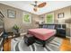 Comfortable bedroom featuring hardwood floors, ceiling fan, and plenty of natural light at 2128 Watkins St, Raleigh, NC 27604