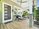 Inviting front porch with seating, offering a relaxing outdoor space to enjoy the neighborhood views at 2128 Watkins St, Raleigh, NC 27604