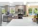 Modern kitchen featuring stainless steel appliances, quartz countertops, and stylish tile backsplash at 2128 Watkins St, Raleigh, NC 27604