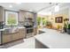 Well-lit kitchen with stainless steel appliances, ample counter space, and stylish mosaic backsplash at 2128 Watkins St, Raleigh, NC 27604