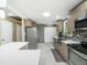Bright, spacious kitchen with stainless steel appliances, island, and ample cabinet space at 2128 Watkins St, Raleigh, NC 27604