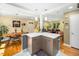 Open-concept view from the kitchen into the dining and living areas featuring hardwood floors and great natural light at 2128 Watkins St, Raleigh, NC 27604