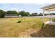 Large backyard showcasing a covered patio and ample space for outdoor recreation and enjoyment at 214 Thumper Way, Clayton, NC 27520