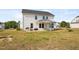 Expansive backyard featuring a covered patio, perfect for outdoor gatherings and relaxation at 214 Thumper Way, Clayton, NC 27520