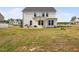 Spacious backyard with a covered patio area, ideal for outdoor activities and entertaining guests at 214 Thumper Way, Clayton, NC 27520