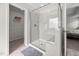 Bathroom featuring glass enclosed shower with built in bench and walk in closet at 214 Thumper Way, Clayton, NC 27520
