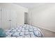 Neutral bedroom with carpet flooring, closet and ensuite access at 214 Thumper Way, Clayton, NC 27520