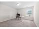 This is a spacious home office or bedroom with a large window and carpet flooring at 214 Thumper Way, Clayton, NC 27520