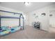 This bedroom features a colorful bed, decor, and carpet flooring at 214 Thumper Way, Clayton, NC 27520