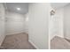 Spacious walk in closet with carpet flooring and shelving system for ample storage at 214 Thumper Way, Clayton, NC 27520