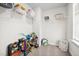 Organized closet featuring white wire shelves and a variety of colorful toys and storage bins at 214 Thumper Way, Clayton, NC 27520